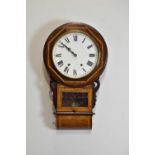 A mahogany cross banded American wall clock, with white painted dial set with Roman numerals, 70cm.