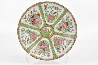 A 19th century Famille Rose wall charger decorated with birds and butterflies, diameter 41cm.