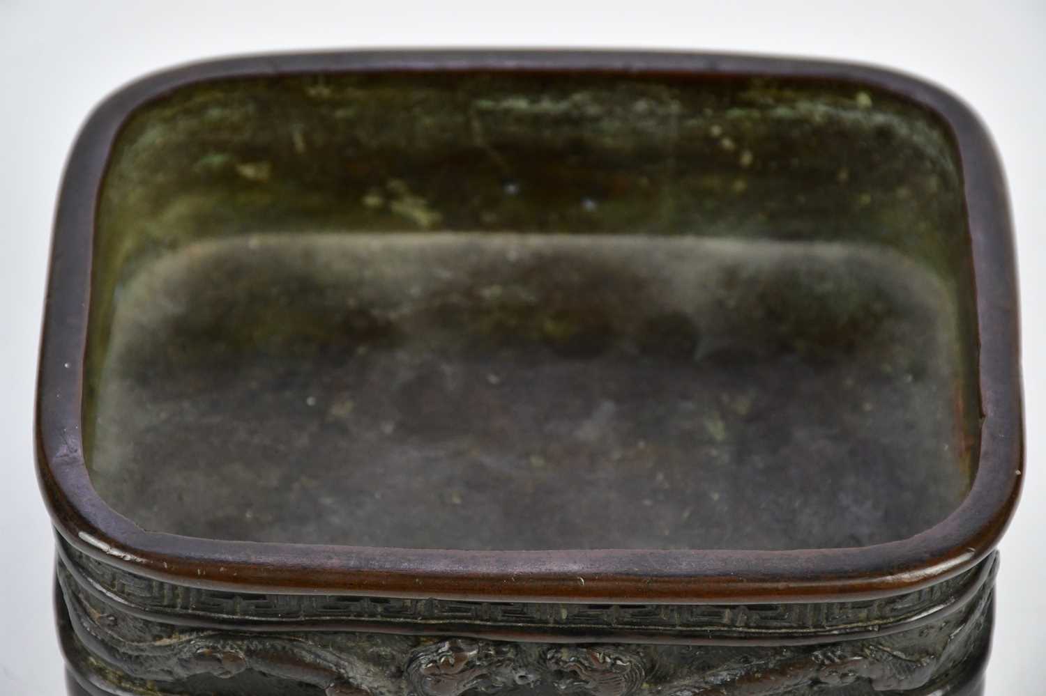 A late 19th century Japanese bronze bowl, with cast decoration of mythical beasts and Greek key - Image 4 of 7