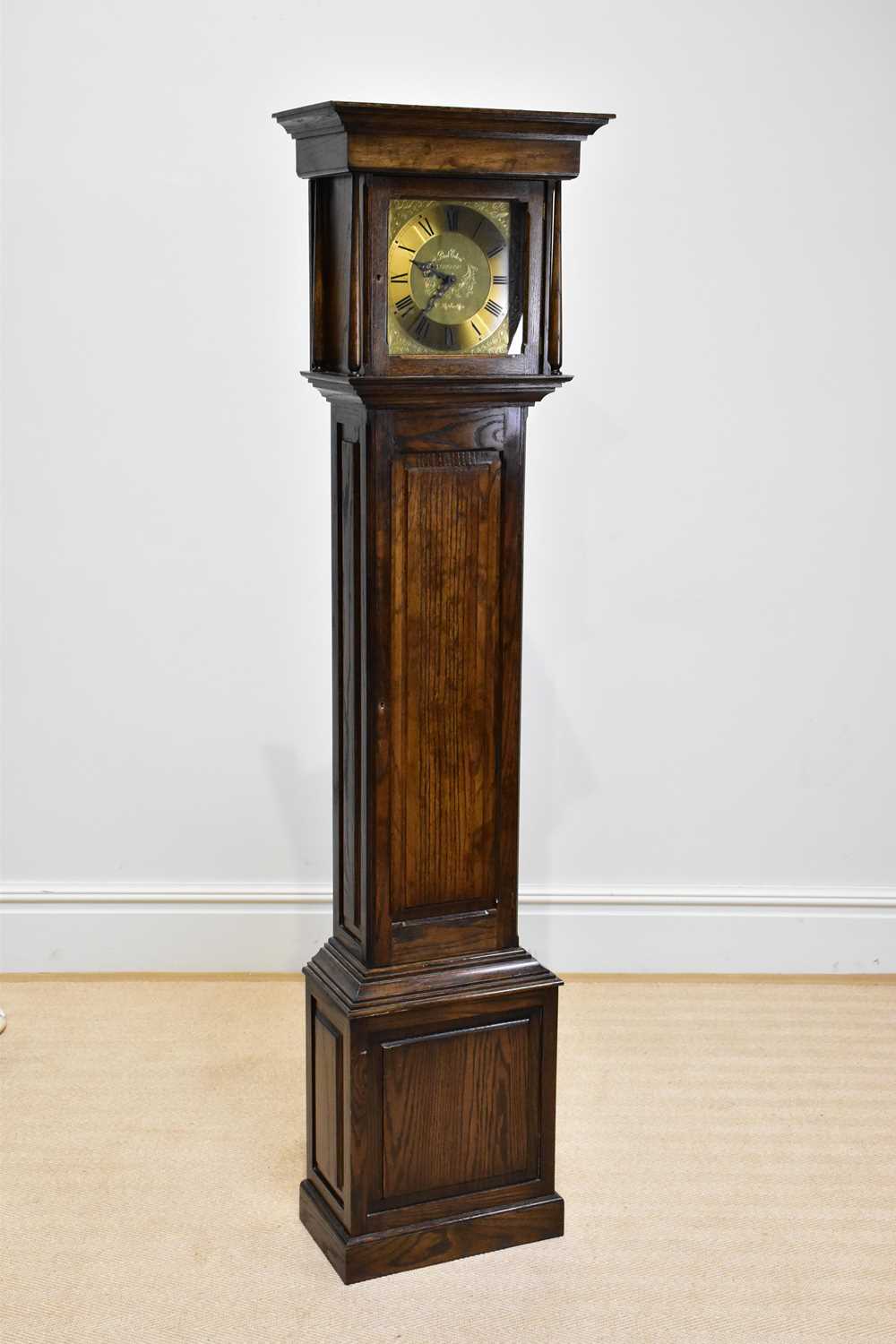 PAUL EDEN, LONGNOR; a reproduction oak longcase clock of small proportions, height 188cm.