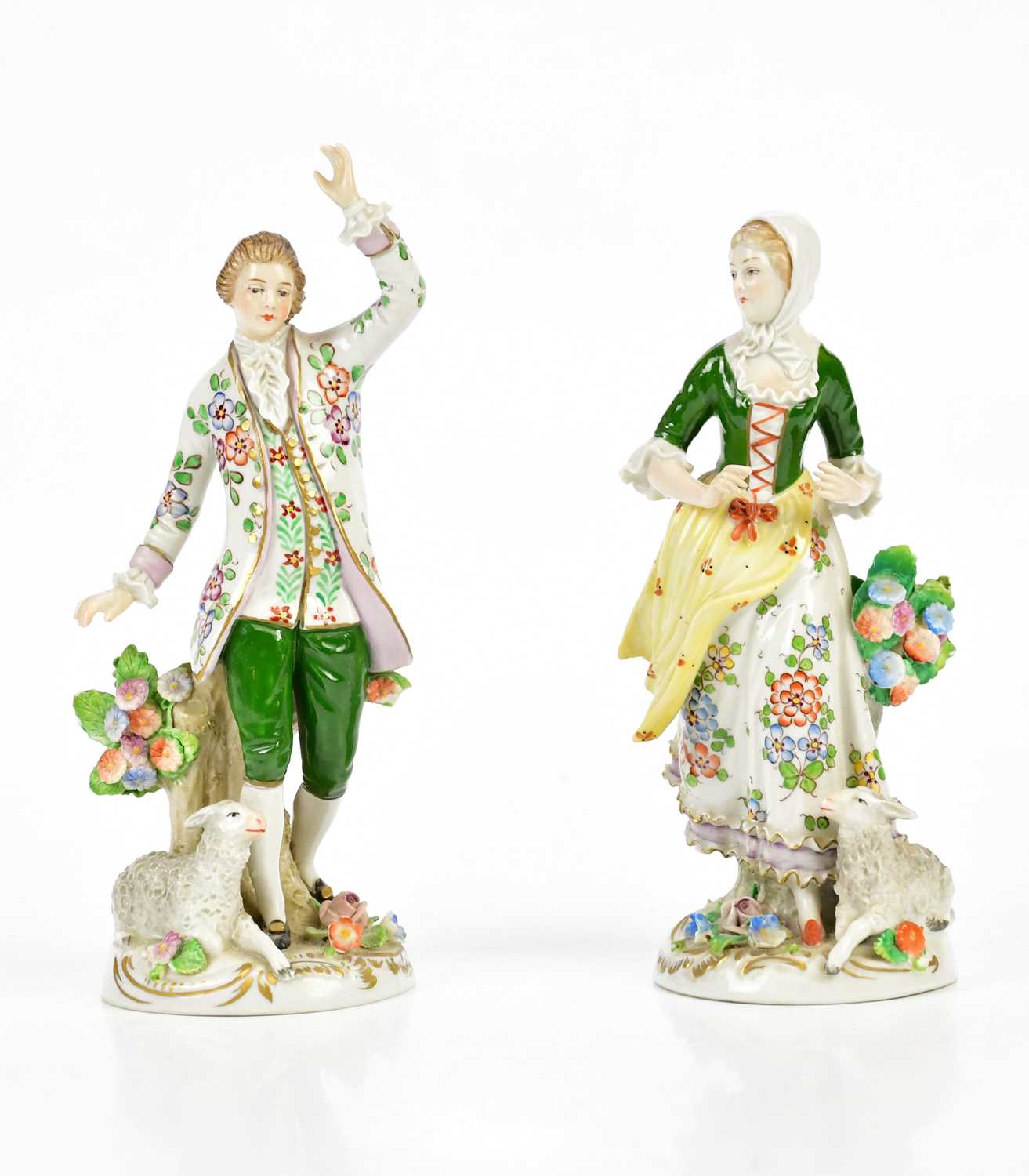 SITZENDORF; a pair of 20th century figures representing a gentleman and lady beside sheep, height