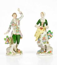 SITZENDORF; a pair of 20th century figures representing a gentleman and lady beside sheep, height