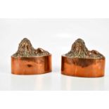 BENHAM & FROUD; a pair of 19th century copper jelly moulds of oval form, topped with recumbent