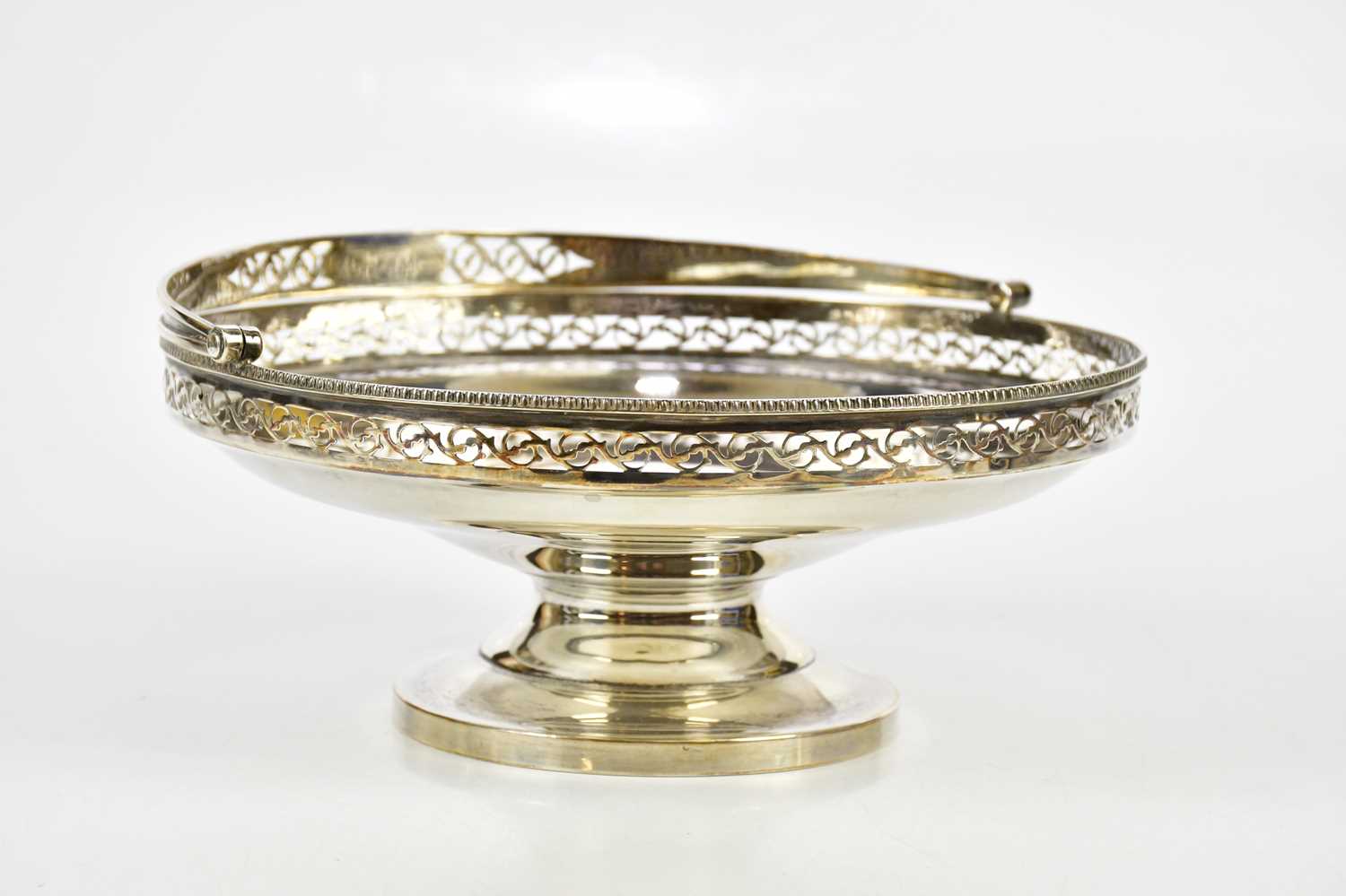 DOCKER & BURN LTD; a George V hallmarked silver pedestal bowl with swing handle, Birmingham 1924,