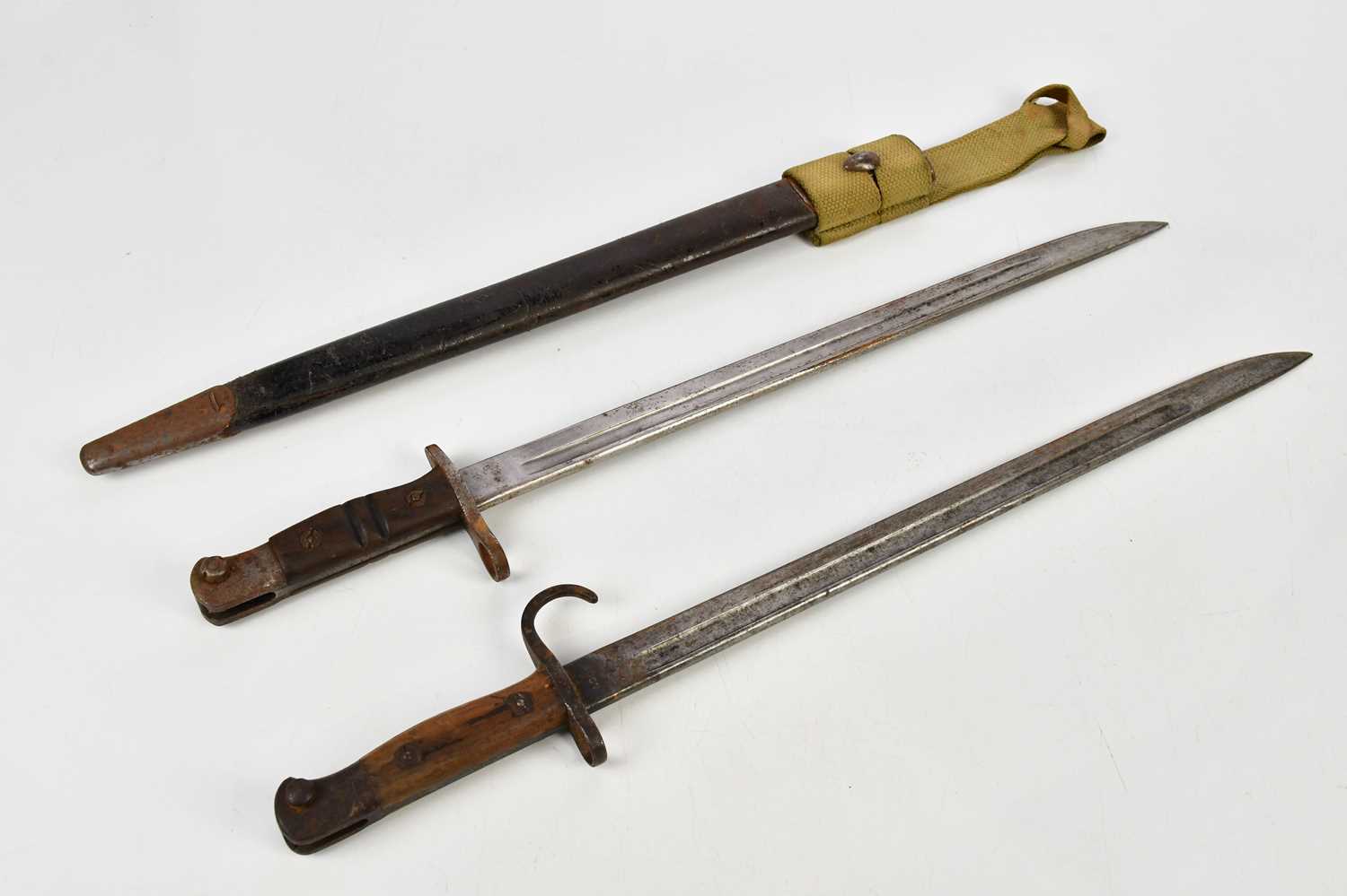A Remington P14 bayonet, dated May 1917, with scabbard and WWII frog, with SMLE pattern bayonet,