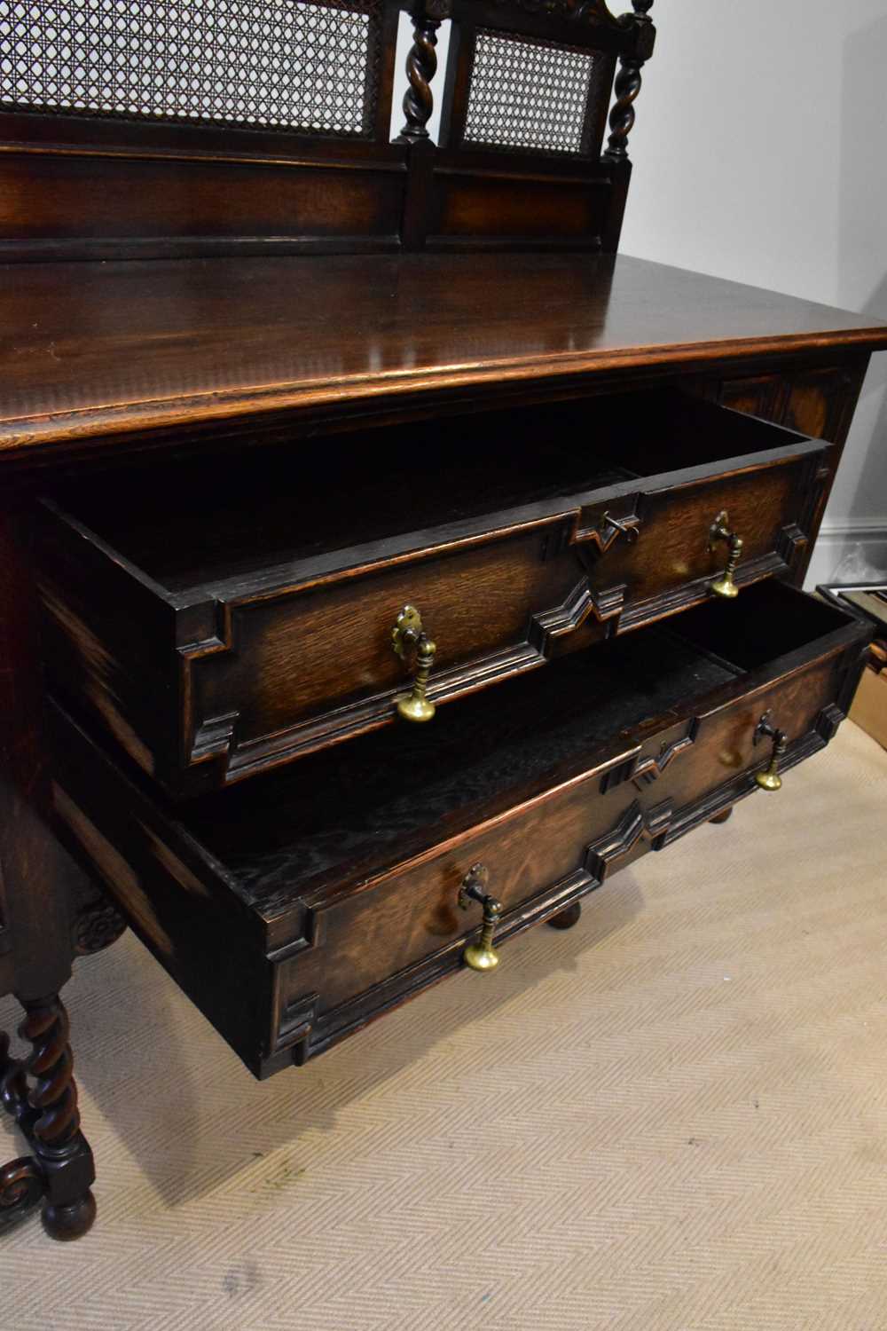 An early 20th century oak sideboard in the Carolean style with cane work raised back with arched top - Image 3 of 6