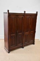 A Victorian oak Gothic Revival vestment cupboard, height 170cm, width 153cm, depth 43cm.