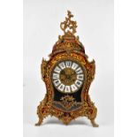 A reproduction Boulle work effect mantel clock in the Rococo style, the dial set with Roman