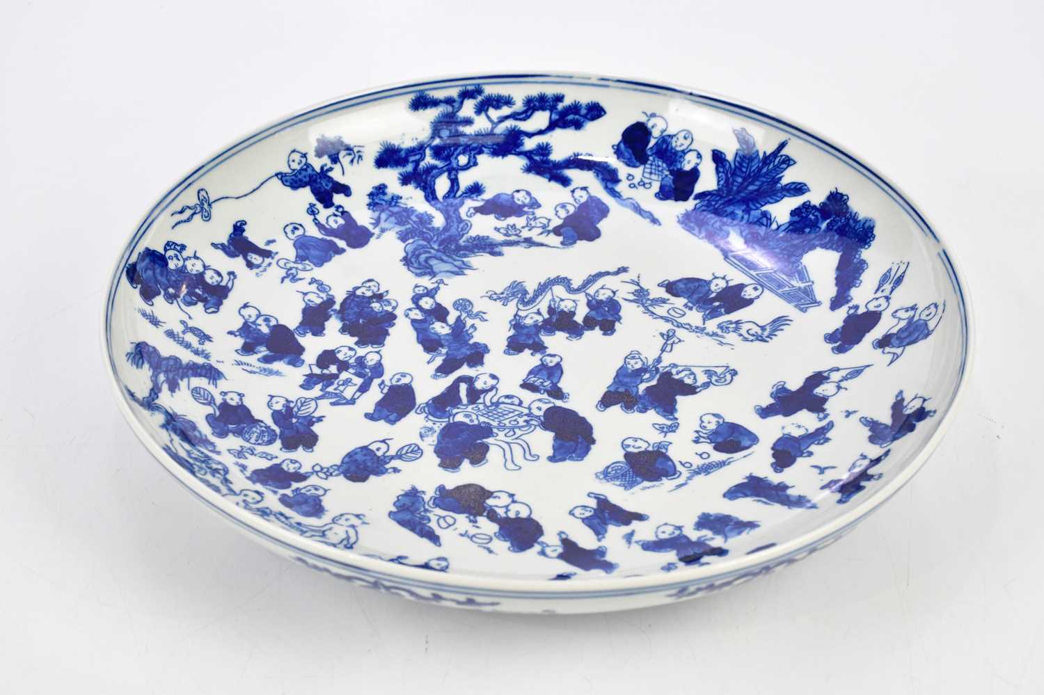 A modern Chinese blue and white bowl, painted with a hundred boys, bears double ring and six