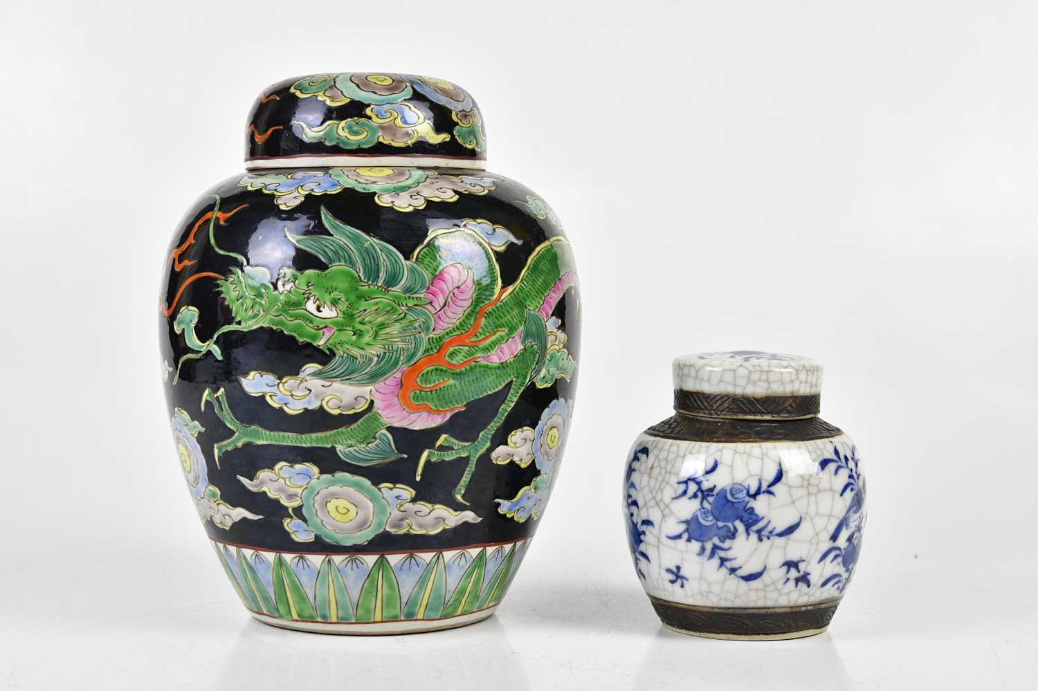 A Chinese Famille Noire ginger jar and cover, decorated with a three claw dragon, height 23cm and