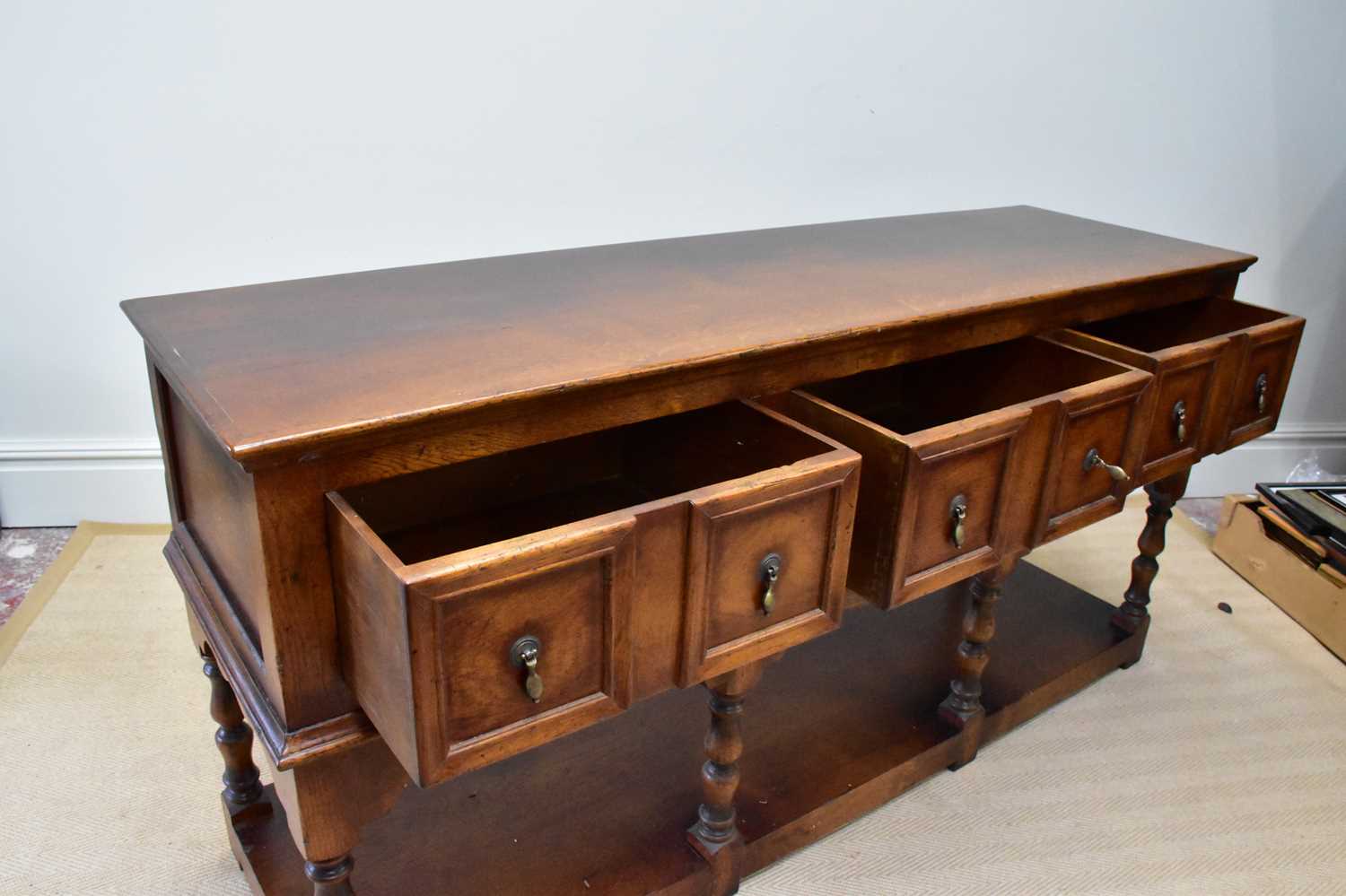 A reproduction oak dresser base with three panelled drawers and undertier, width 172cm, depth - Image 2 of 4