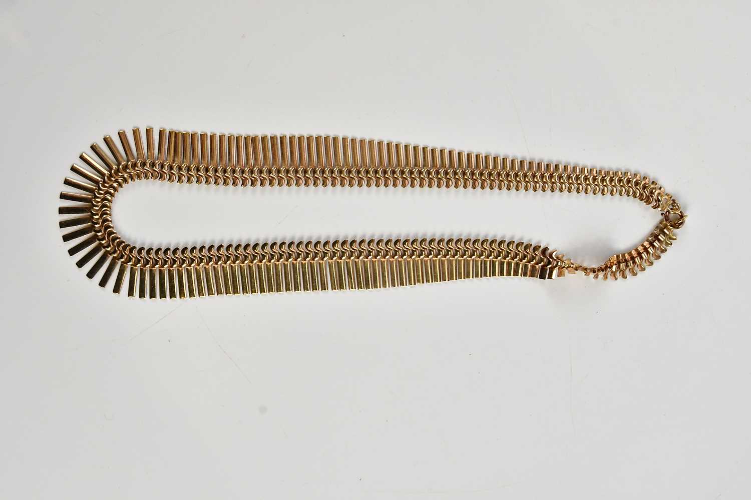 A yellow metal fringe collar necklace, stamped 9c, approx weight 22.6g.