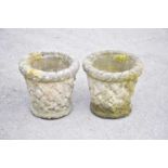 A pair of reconstitued stone planters with relief lattice style decoration, height 40cm.