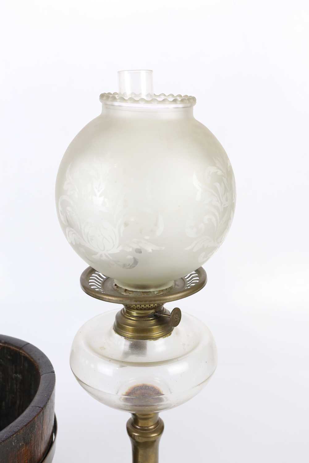 A 20th century brass oil lamp with replacement frosted glass shade and clear glass reservoir, height - Image 2 of 4