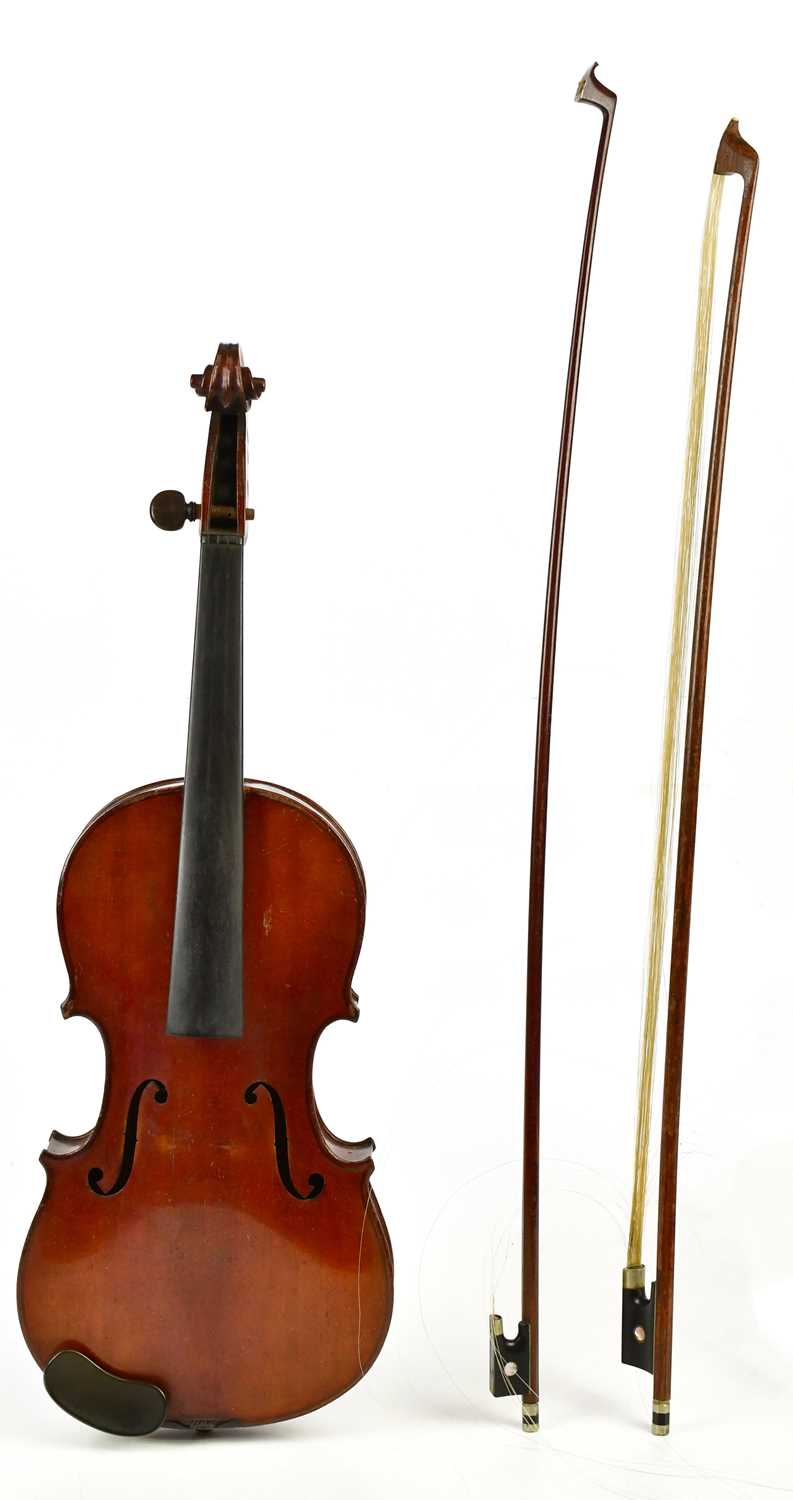 A full size German violin with two-piece back length 35.4cm, unlabelled, cased with two bows.
