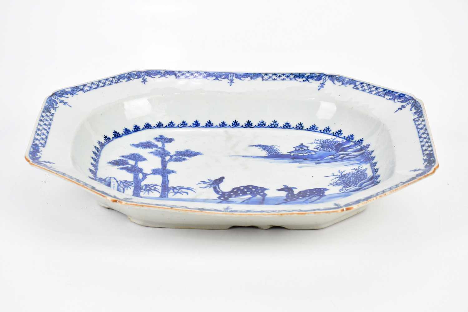 An 18th century Chinese blue and white export ware meat plate, decorated with deer in landscape,