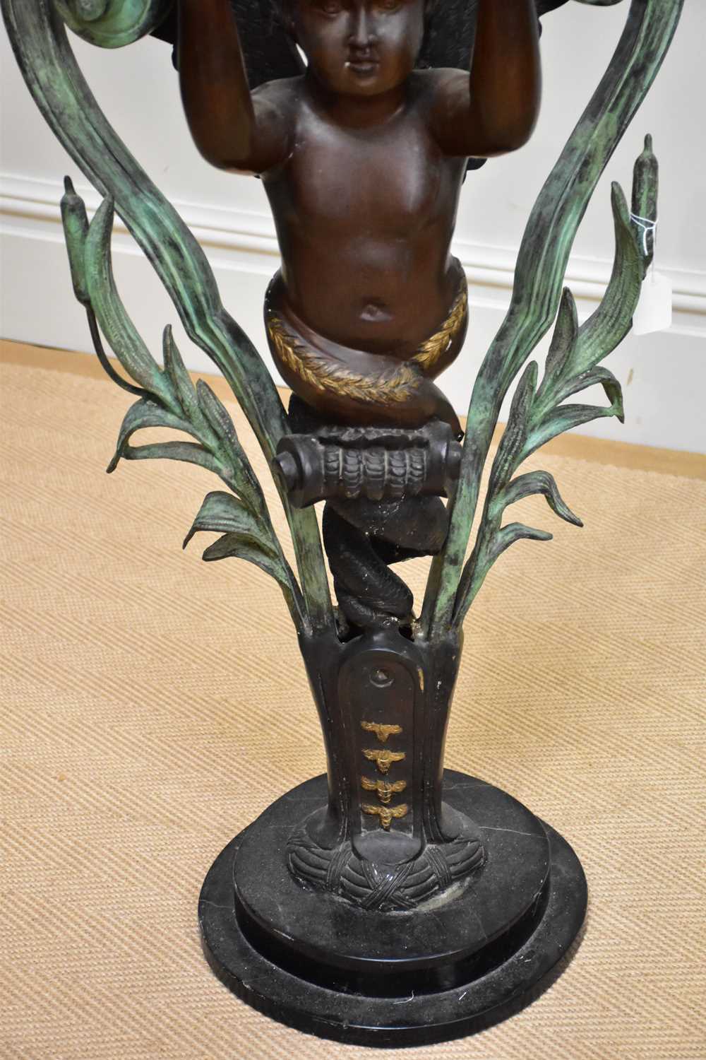 A modern decorative patinated metal figure of a standing cherub on marble base, height 90cm. - Image 3 of 4