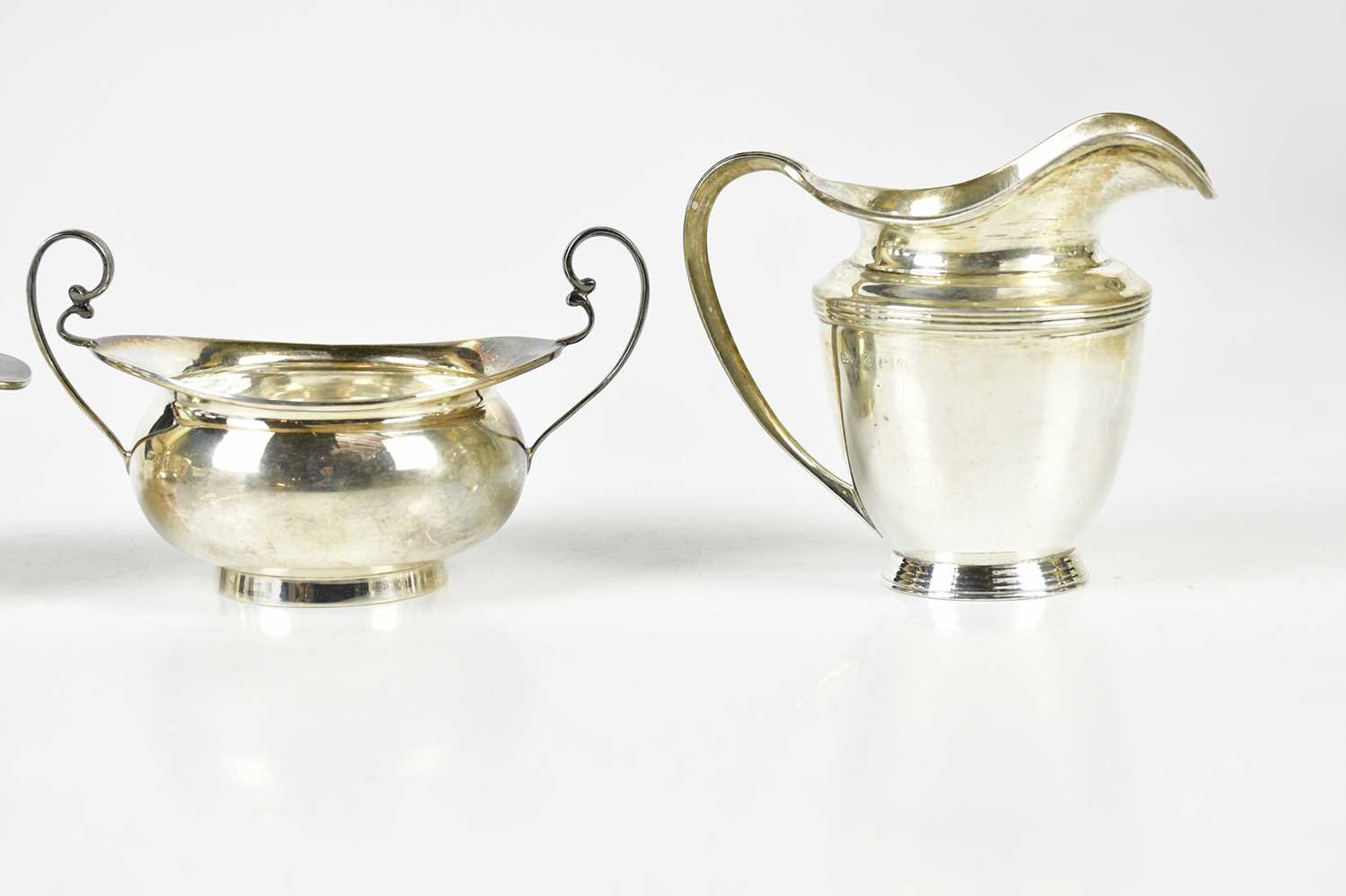 A George V hallmarked silver jug and sugar bowl, Birmingham 1919, and another jug and sugar, - Image 3 of 5