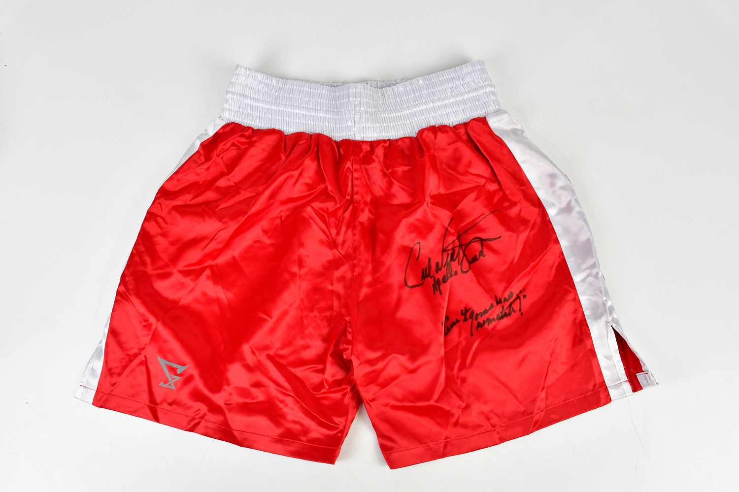 CARL WEATHERS (APOLLO CREED); a pair of red and white signed boxing shorts, inscribed 'There ain't