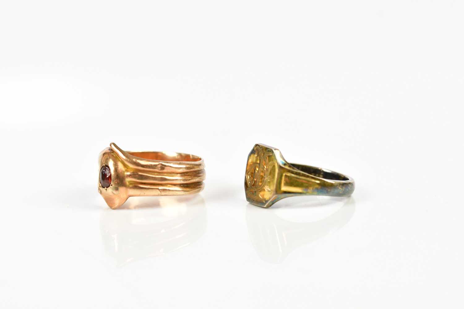 A 9ct yellow gold garnet set ring in the form of a stylised snake, size M, weight 2.2g, together - Image 2 of 4