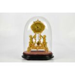 A late 19th century ormolu mantel clock, the oval dial set with Roman numerals on scrolling sabre