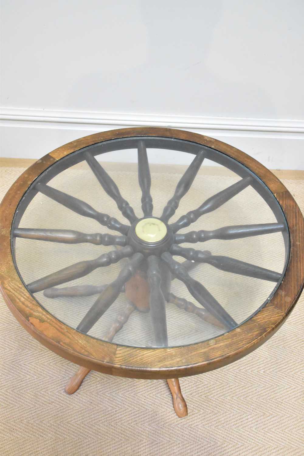 A pair of modern oak cartwheel coffee tables with glass tops, diameter 74cm. - Image 2 of 3