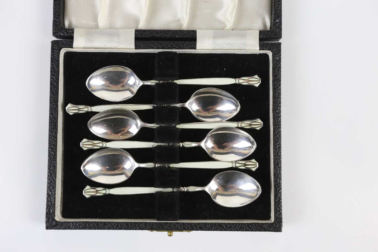 HENRY CLIFFORD DAVIS; a cased set of six George VI hallmarked silver and enamel teaspoons,