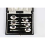 HENRY CLIFFORD DAVIS; a cased set of six George VI hallmarked silver and enamel teaspoons,