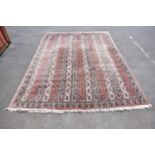 A large pink ground Eastern style carpet with paisley pattern design, 260 x 390cm.