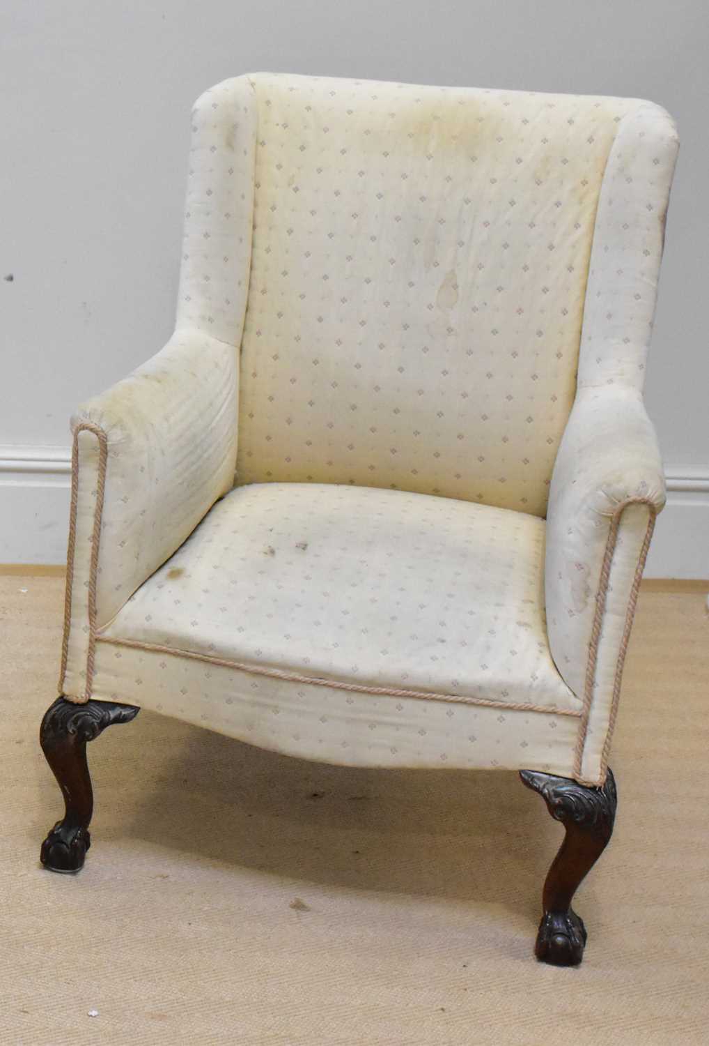 An early 20th century wingback armchair, height 95cm.