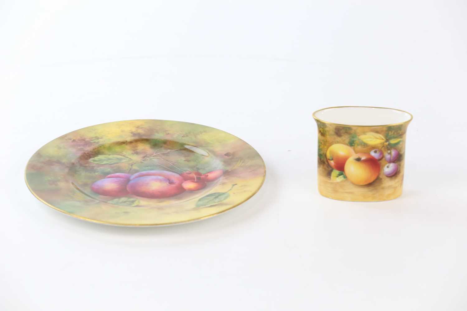 E TOWNSEND FOR ROYAL WORCESTER; a hand painted plate decorated with fruits, together with a