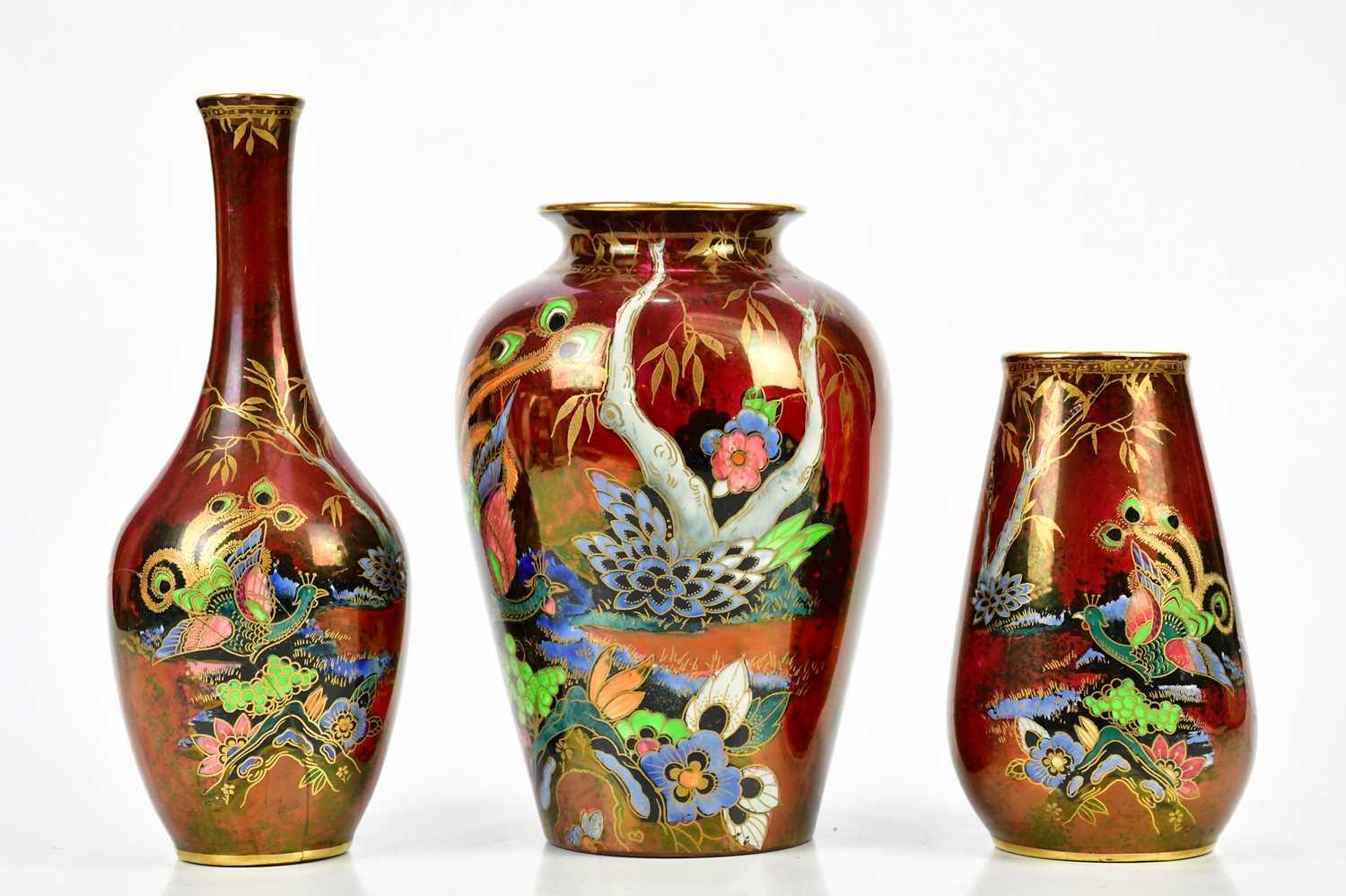 DEVON LUSTRINE FIELDINGS; three Art Deco vases including a bulbous example decorated with a