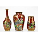 DEVON LUSTRINE FIELDINGS; three Art Deco vases including a bulbous example decorated with a