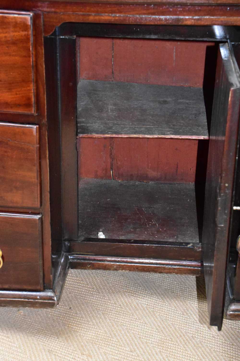 A George III mahogany kneehole desk, the seven drawers with later handles around a central - Bild 4 aus 4