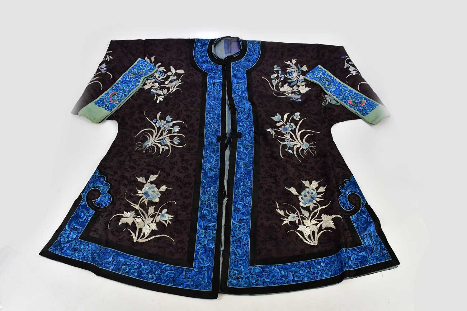 A late 19th century Chinese kimono with floral and insect decoration, width sleeve to sleeve 128cm.