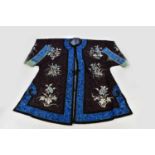A late 19th century Chinese kimono with floral and insect decoration, width sleeve to sleeve 128cm.