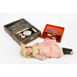 A Victorian leather travelling vanity set, the hinged cover enclosing fitted compartments and