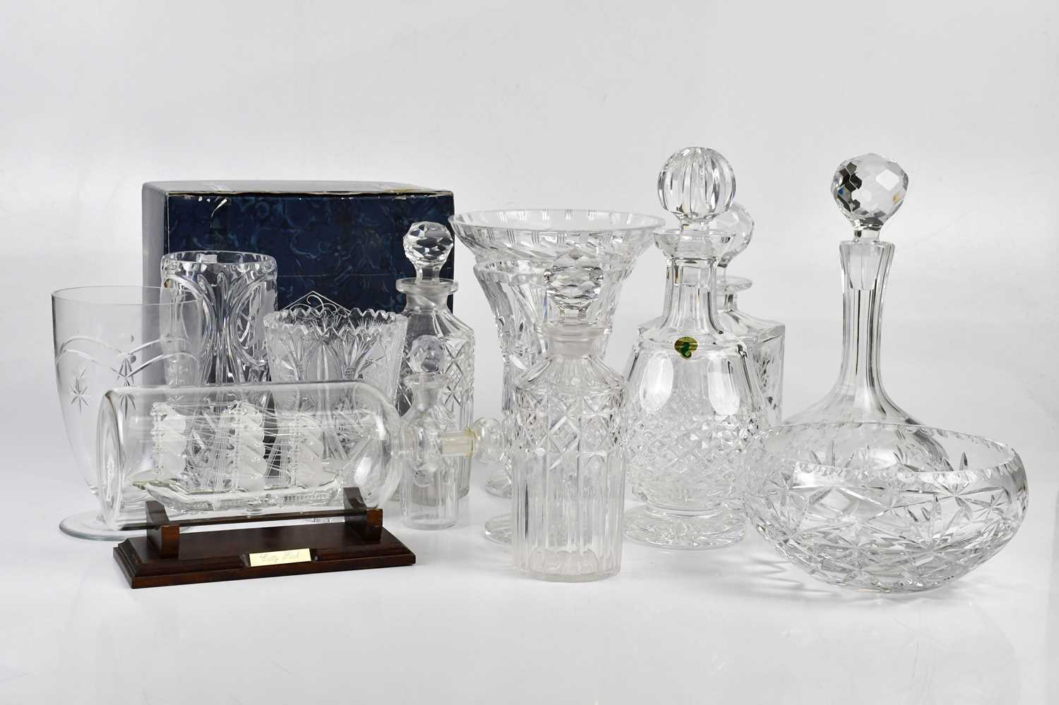 A collection of assorted glassware, including a Webb decanter, a Waterford decanter, a Royal Doulton