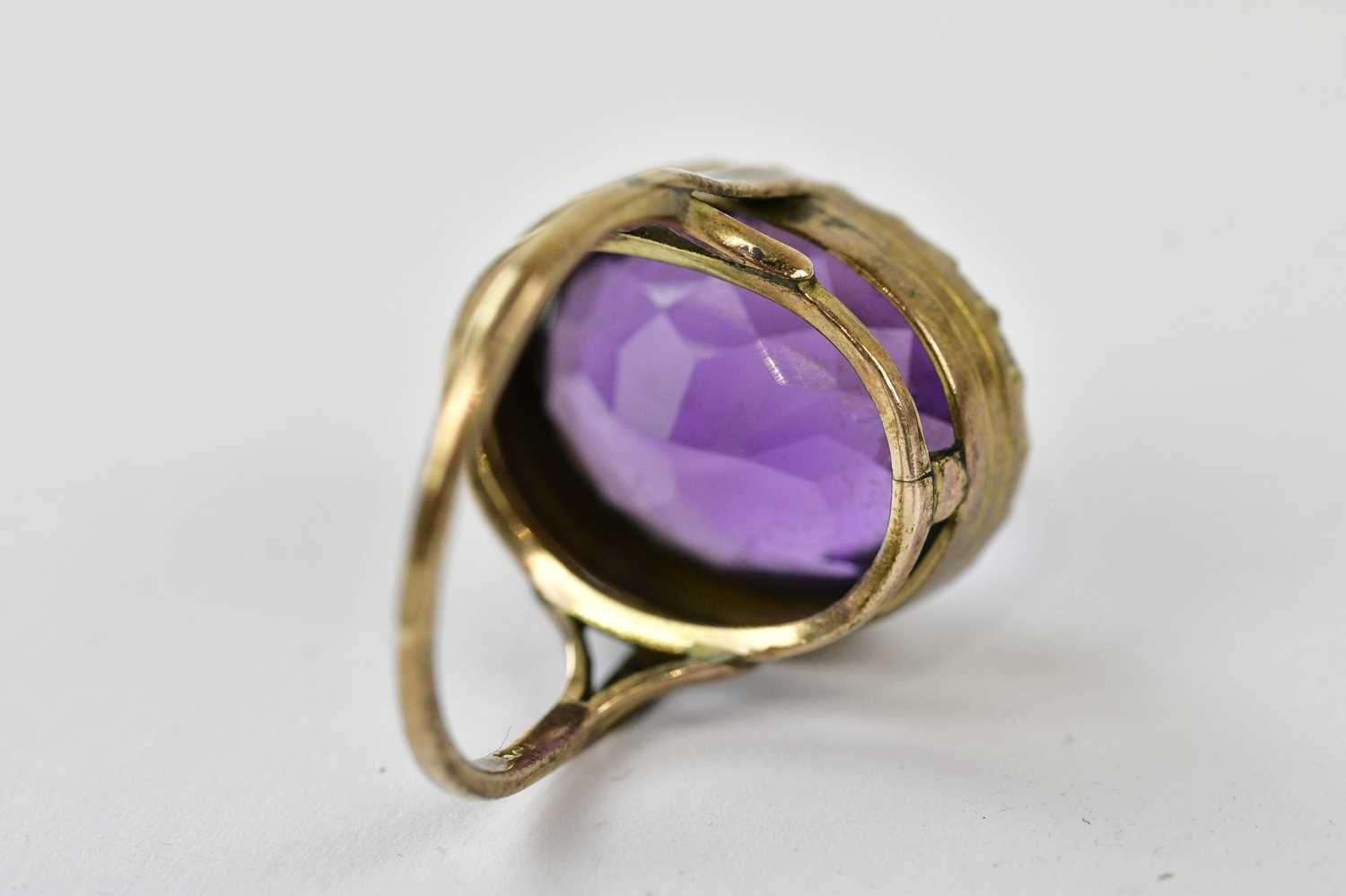 A Victorian yellow metal amethyst dress ring, indistinctly stamped possibly 9c, size N, approx 6. - Image 2 of 3