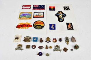 A small collection of army patches including Royal Armoured Corps, Desert Rats, 2nd Infantry