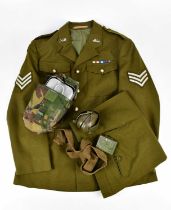 A vintage Manchester Regiment uniform and assorted military accessories including ear defenders,