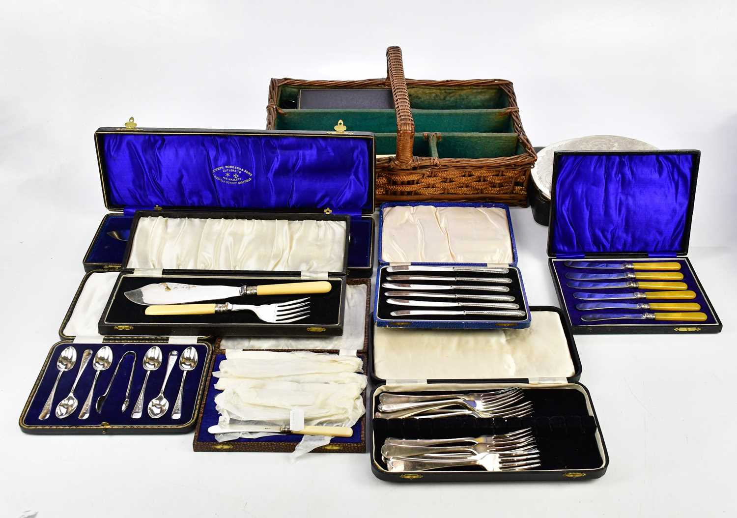A collection of assorted silver plated cutlery, predominantly cased, a diamond cut throat razor,