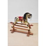 A vintage painted rocking horse on pine stand, height 90cm, length 104cm. Condition Report: Chips to