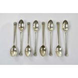 C W FLETCHER & SONS LTD; a set of eight George VI hallmarked silver teaspoons, with cast Art Nouveau