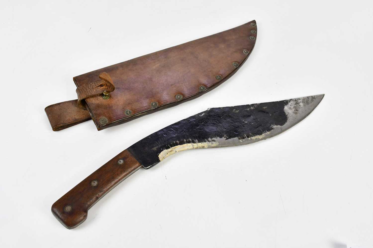 A wooden handled cutlass in leather scabbard.