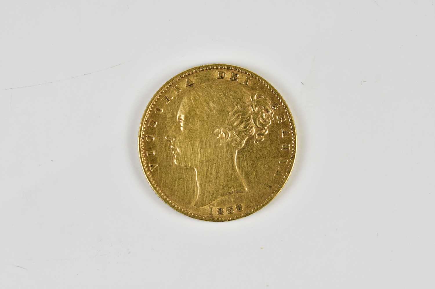 A Victorian full sovereign, 1866, young head, shield back.