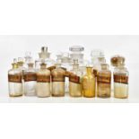 A collection of Victorian and later pharmaceutical bottles, predominantly examples with paper