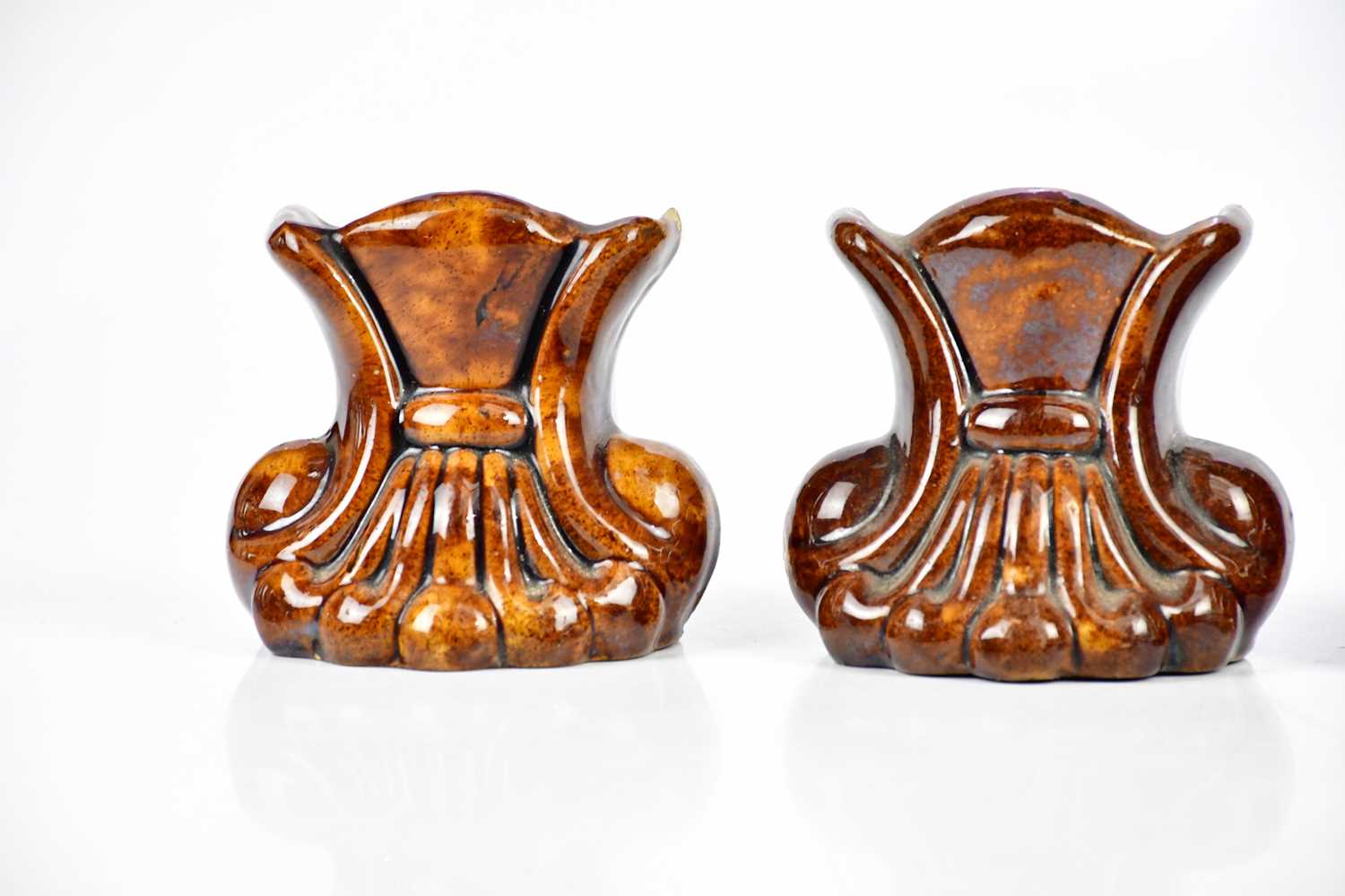 Two pairs of 19th century treacle glaze furniture rests modelled as scrolls, height 10.5cm (4). - Image 2 of 4