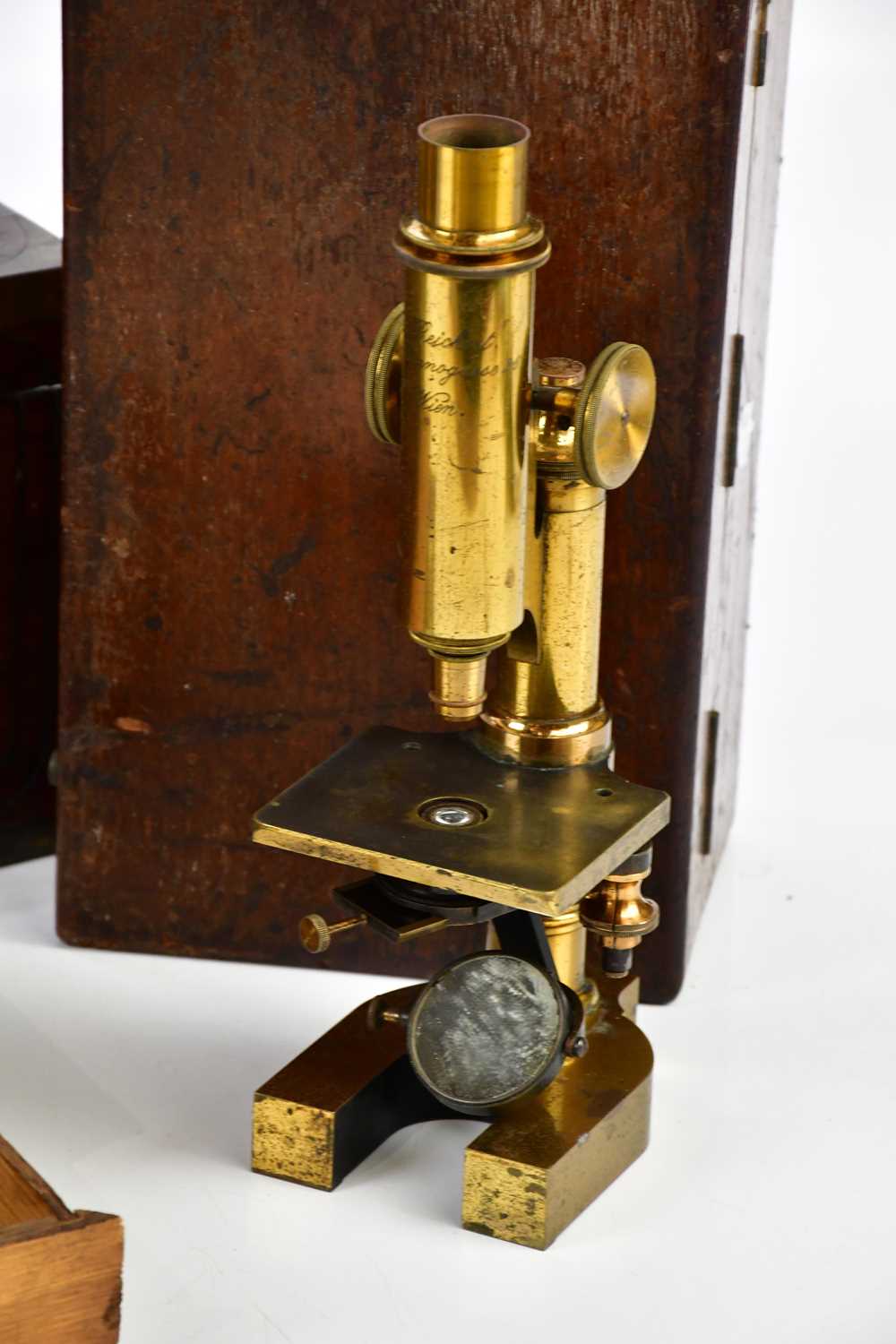 G REICHERT, VIENNA; a brass lacquered microscope with lenses, a 19th century brass bound campaign - Image 3 of 3