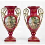 A pair of 20th century Continental porcelain twin handled pedestal vases, transfer printed with